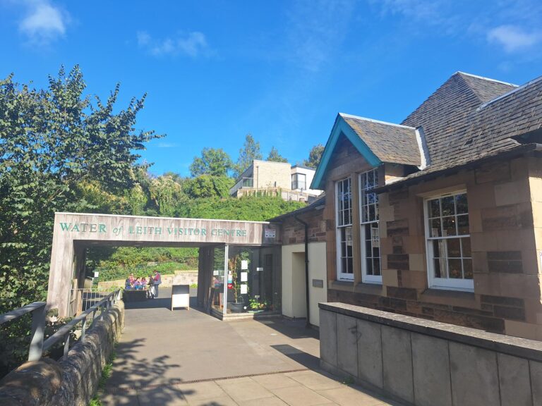 a view of the Visitor Centre highlighted against a vivid blue sky in a rare moment of Scottish Sunshine